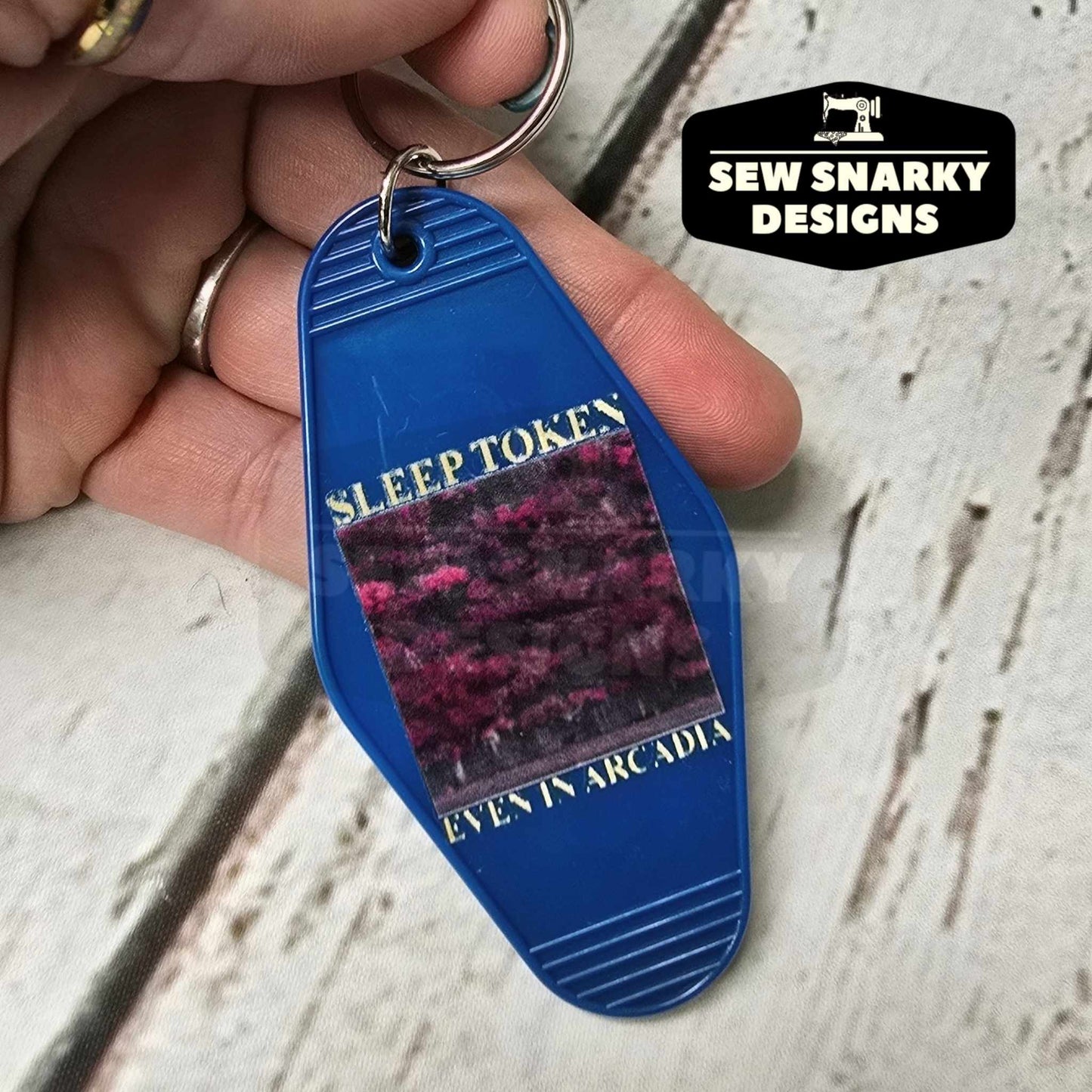 ST Even In Arcadia Hotel Keychain